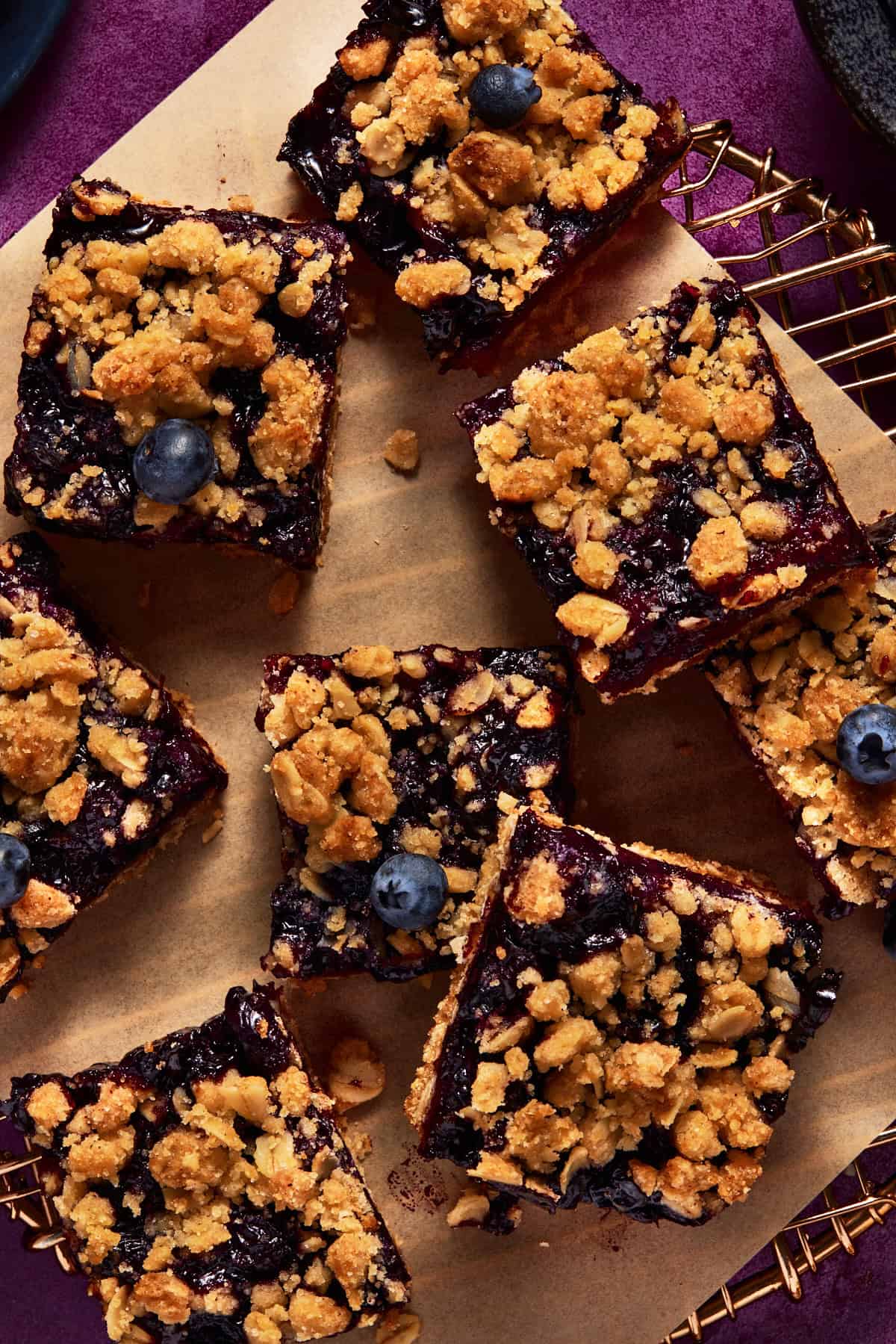 Blueberry Oat Crumble Bars on a metal cooling rack. 