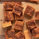 Snickerdoodle Bars cut and placed on parchemnet paper.