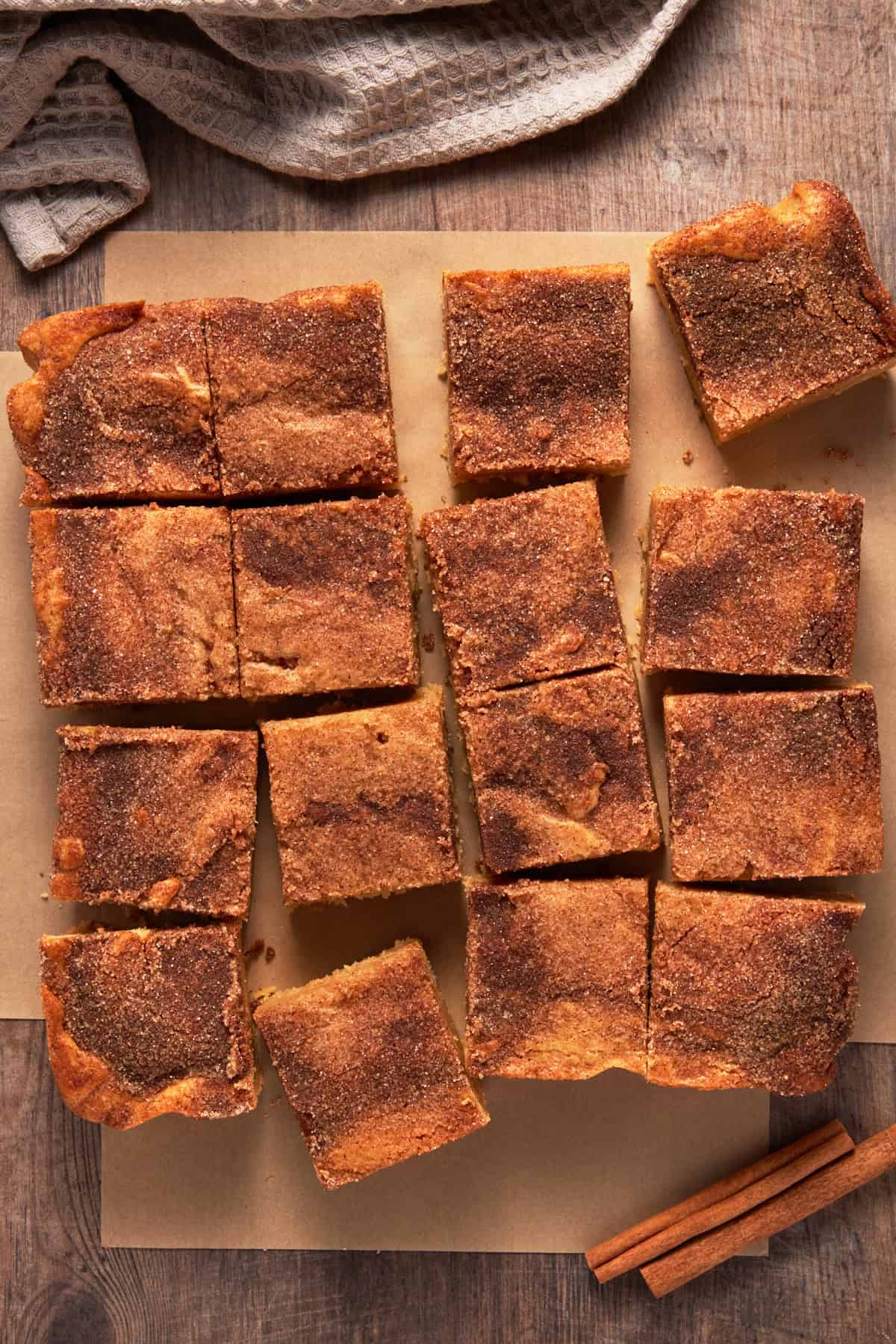 Cut Snickerdoodle Bars on parchment.