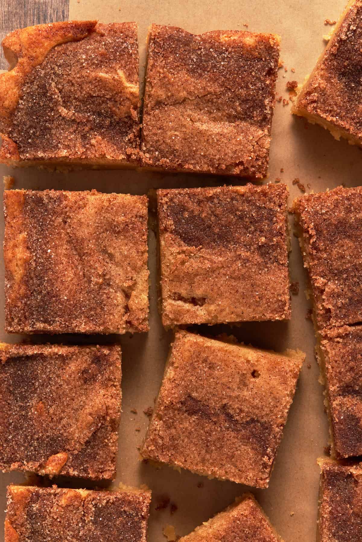 Cut snickerdoodle bars on a piece of parchment paper. 