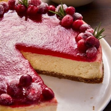 Cranberry Cheesecake with a slice removed.