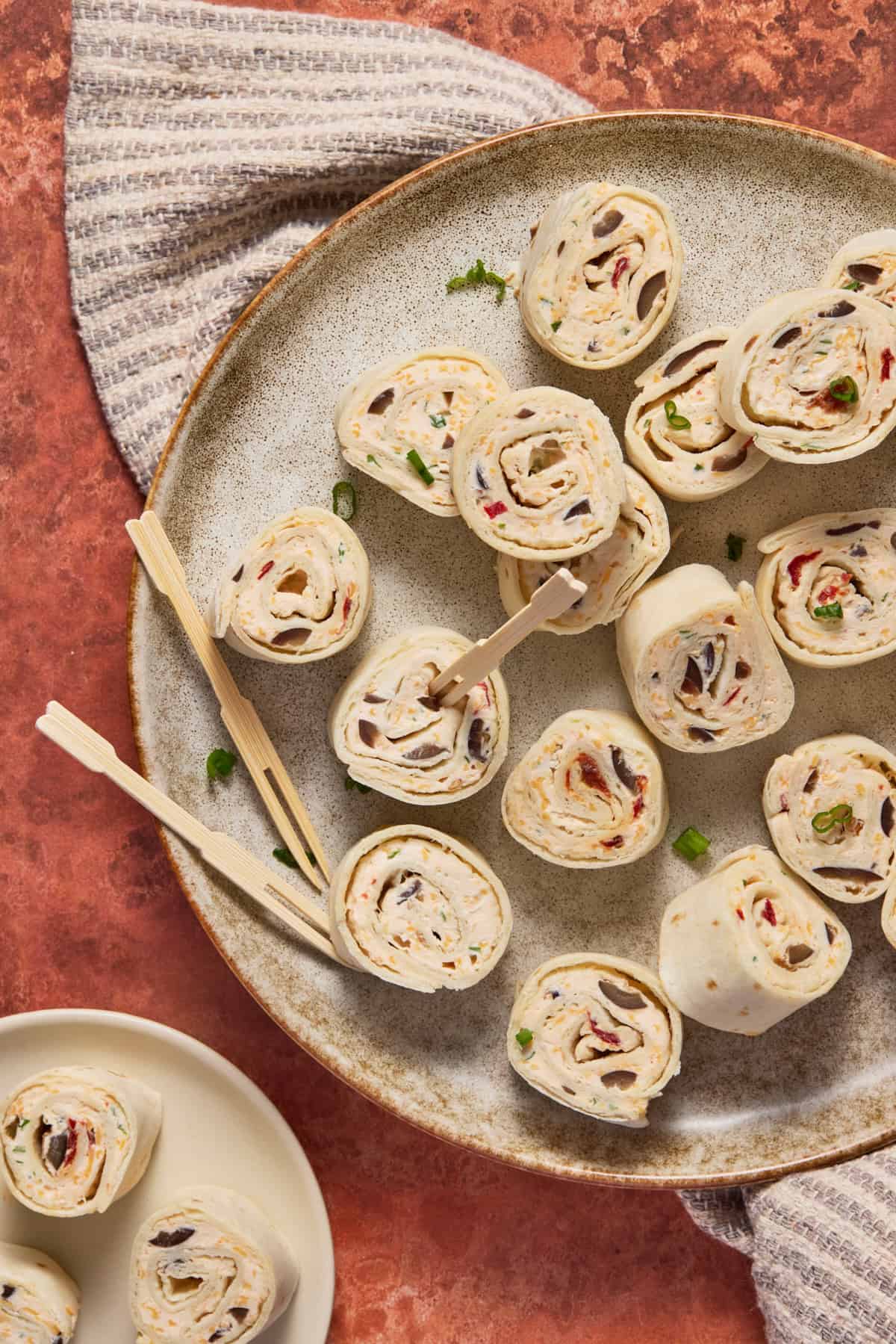 Cheesy Chipotle Roll ups on plated sliced and ready to eat.